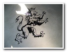 Lion heraldic graphic on concrete floor